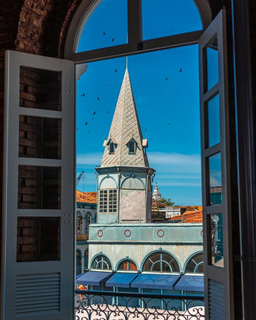 Charming view of Ver-o-Peso Market through an open window, highlighting its iconic architecture.